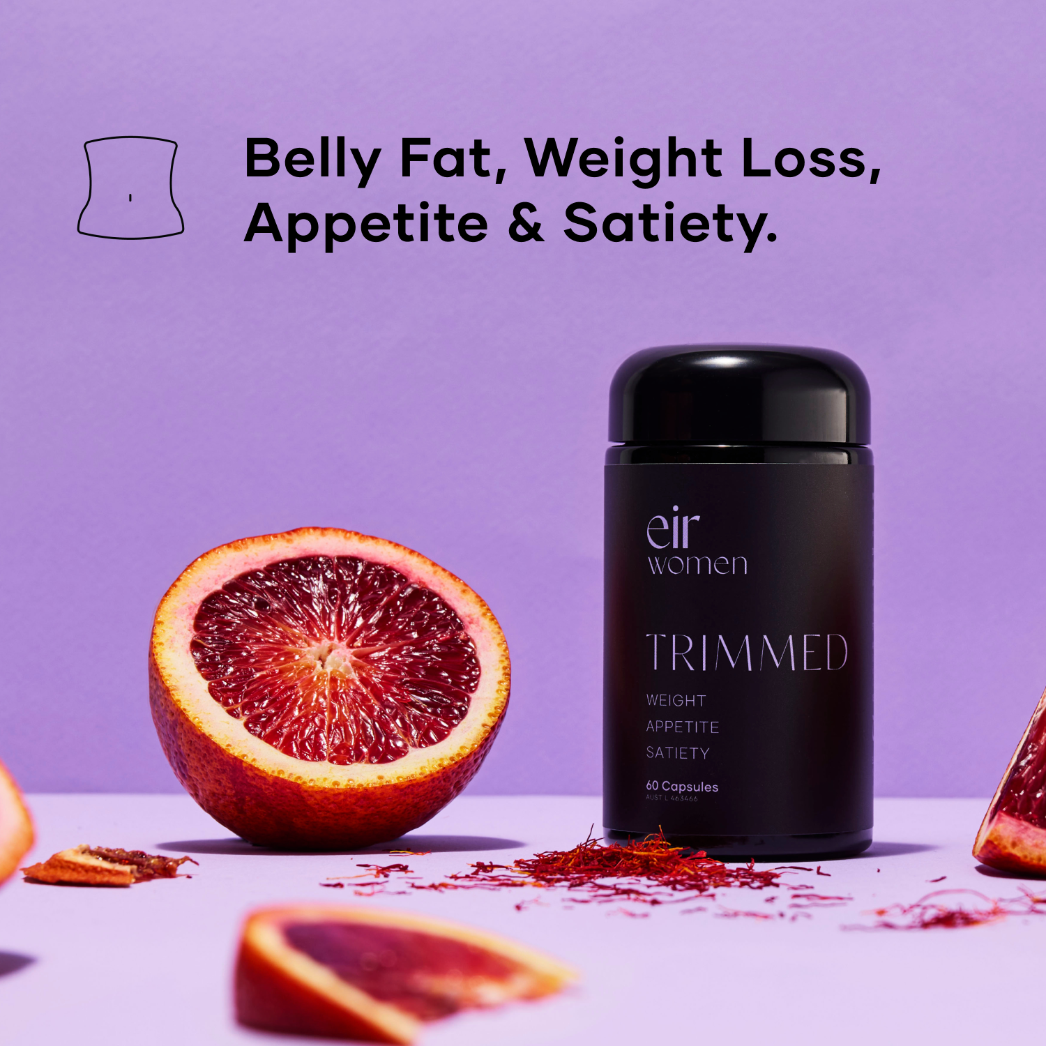 Trimmed Eir Women Weight-Loss Supplement, beside a blood orange, against a purple background 
