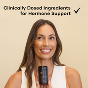 Woman holding a glass black bottle of Show Up Eir Supplement, For Energy, Stress, Brain Health - Clinically dosed ingredients for hormone support