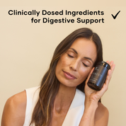 Woman with closed eyes holding a bottle of Reboot