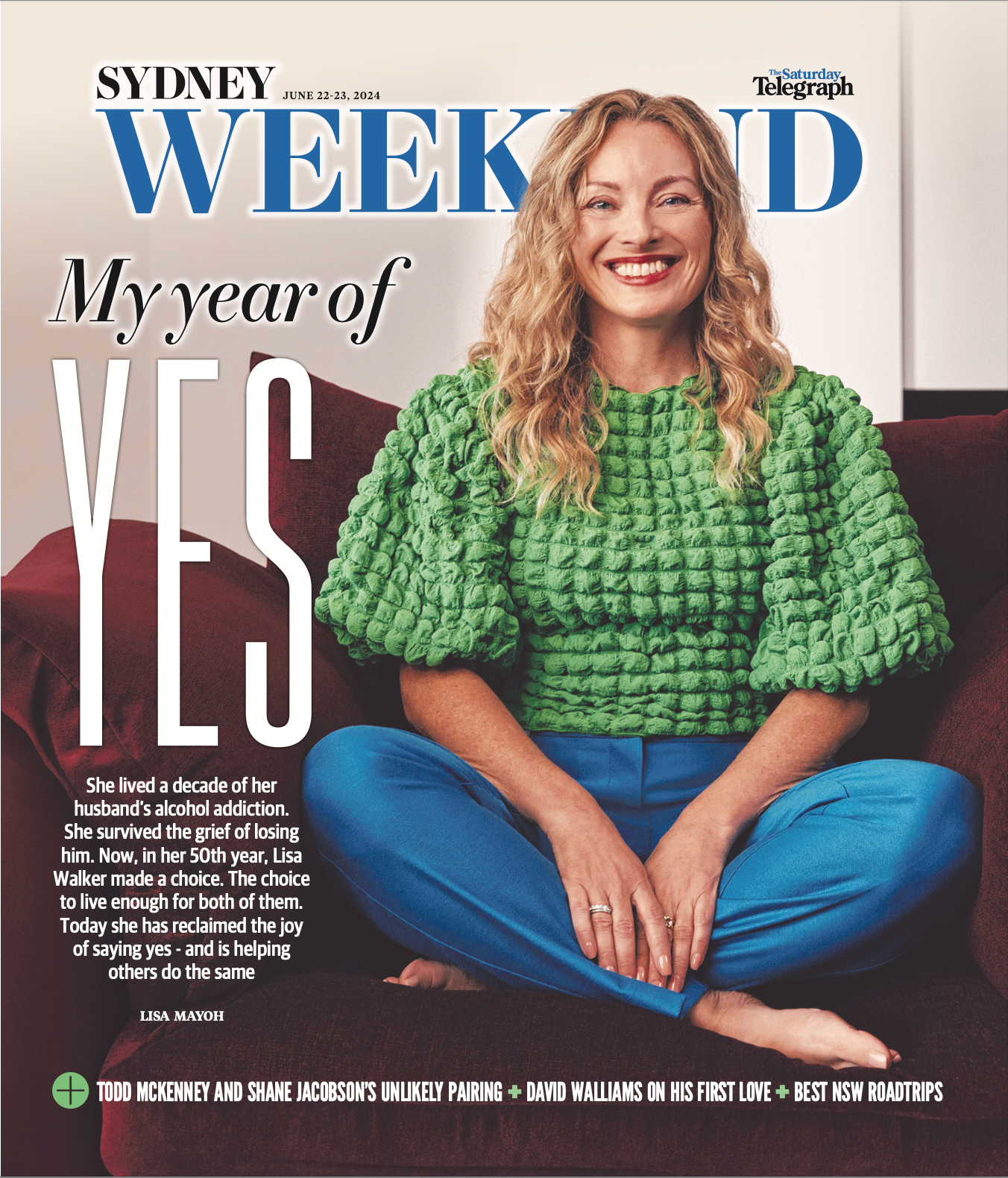 Woman in green textured sweater and blue pants sitting on a couch with 'Sydney Weekend' magazine cover text.