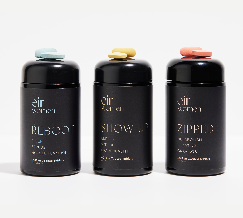 Black bottle of Reboot Eir Supplement with blue print, black bottle of Show Up Eir Supplement with yellow print, Black bottle of Zipped Eir Supplement with pink print
