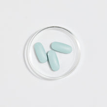Load image into Gallery viewer, Eir Women Reboot blue tablets sitting in Petri dish
